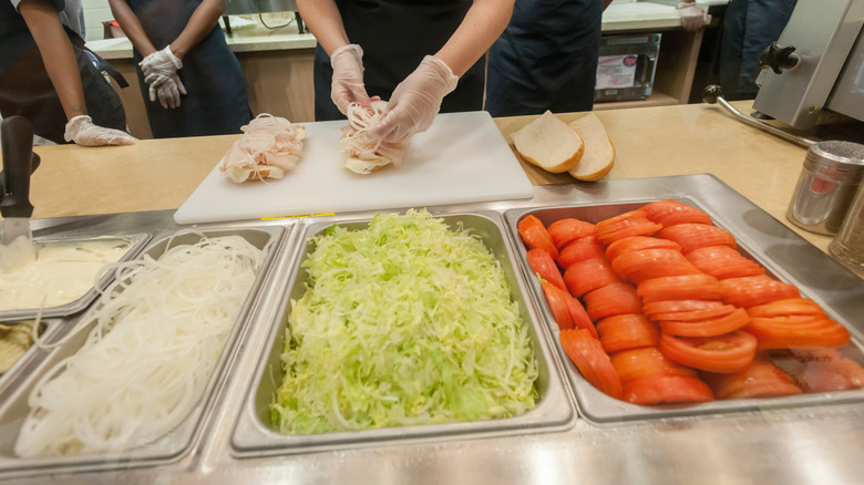 Jersey Mike's employee making sandwich