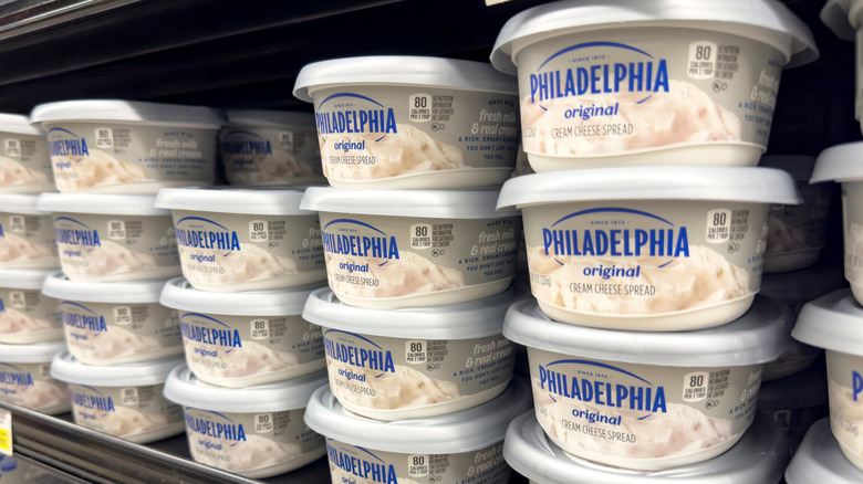 Tubs of Philadelphia cream cheese on store shelf