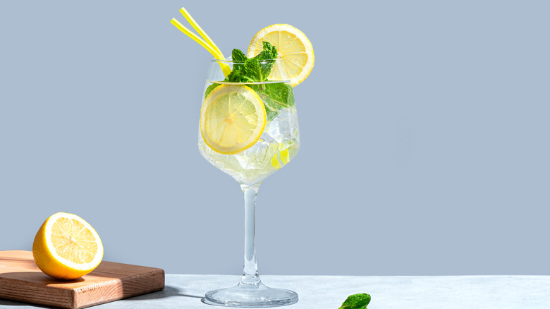 lemonade cocktail with lemon and mint garnish