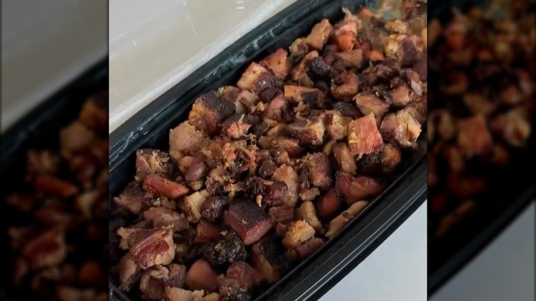 Costo smoked pork bites in black plastic container