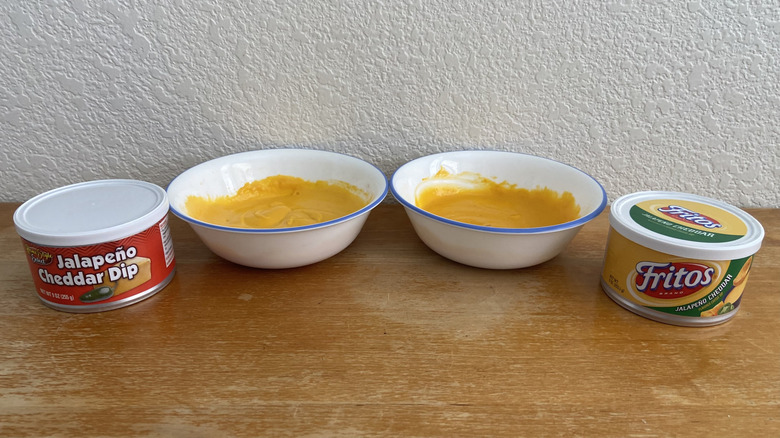 Bowls of Home Style Select Jalapeño Cheddar Cheese Dip and Fritos Jalapeño Cheddar Cheese Dip next to packages.