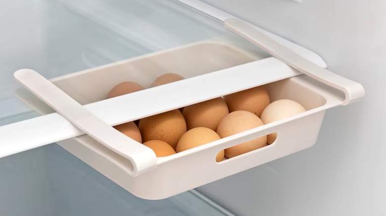 Egg holder from Dollar Tree in fridge holding eggs