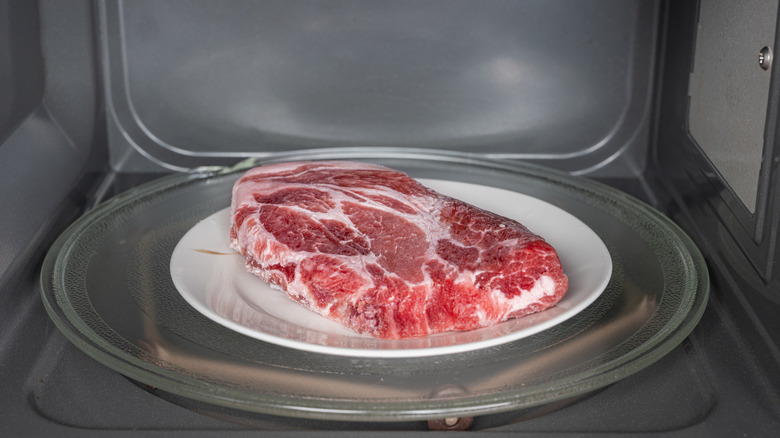 Meat thawing in a microwave