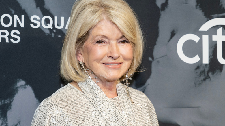 Martha Stewart smiles in sequins and diamond earrings at an event