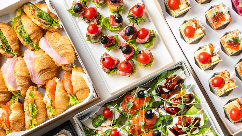 Various small bites arranged on a table on serving plates