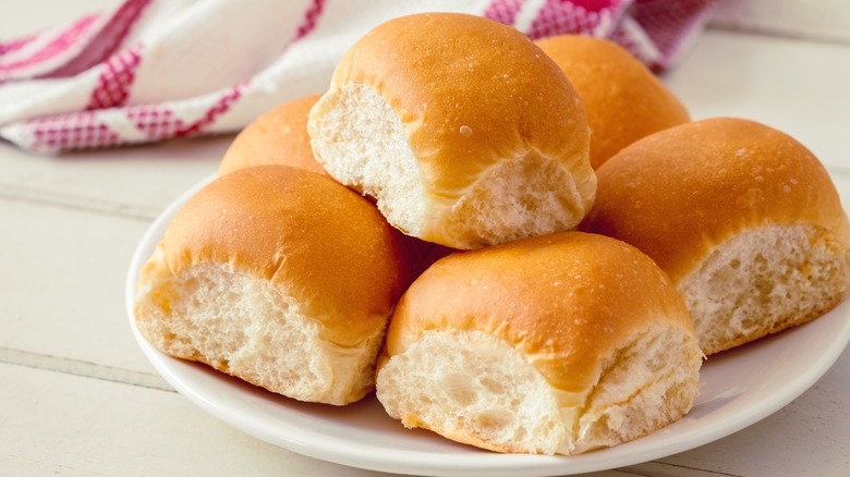 Bread rolls on a white plate.