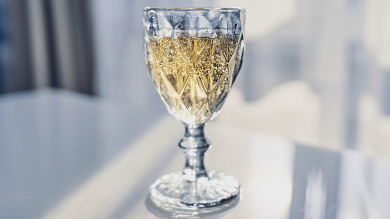 Crystal glass filled with sparkling wine