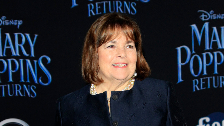 Ina Garten in black jacket smiles at event