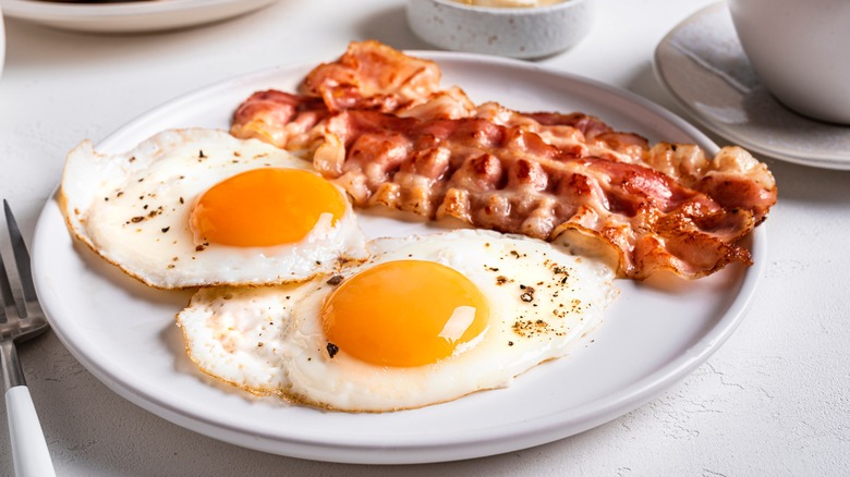 Fried eggs and bacon on a plate