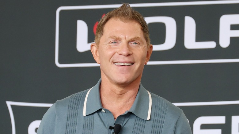 Headshot of Bobby Flay smiling during cooking demonstration.