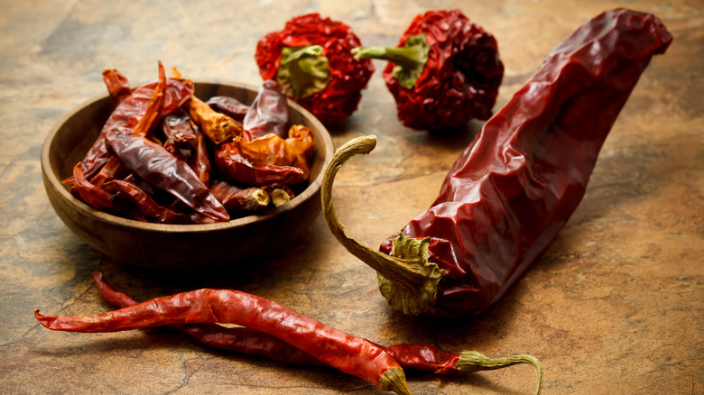 Assorted dried chili peppers gathered together
