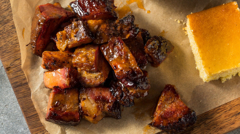 Burnt ends on parchment paper with corn bread