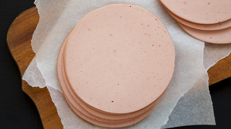 Slices of bologna on parchment paper