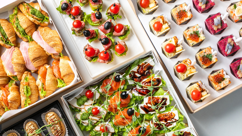 Various appetizers and canapes on a table for a party
