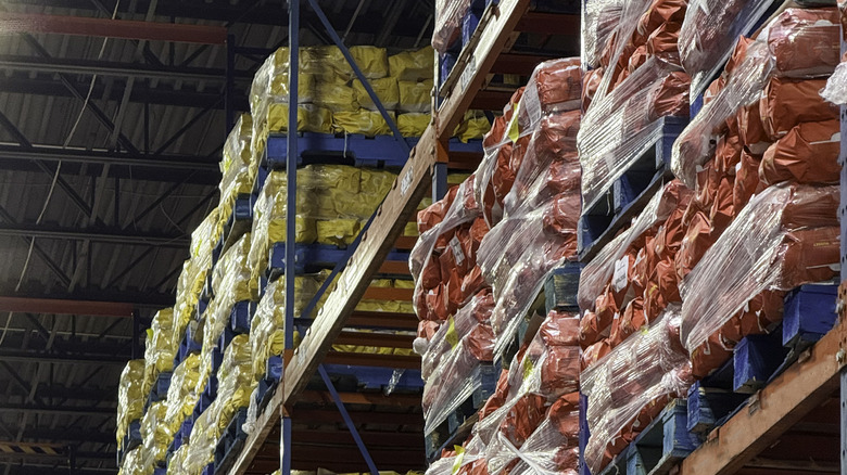 Shelves of potato sacks in a warehouse