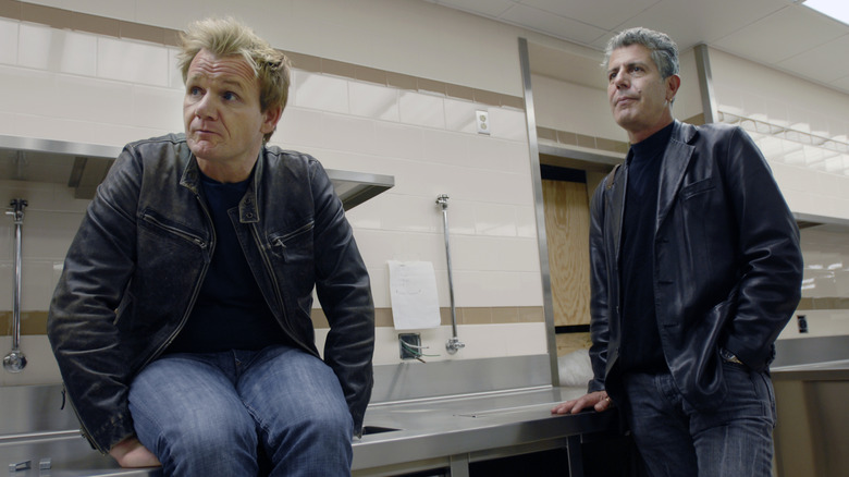 Gordon Ramsay and Anthony Bourdain together in an empty kitchen.