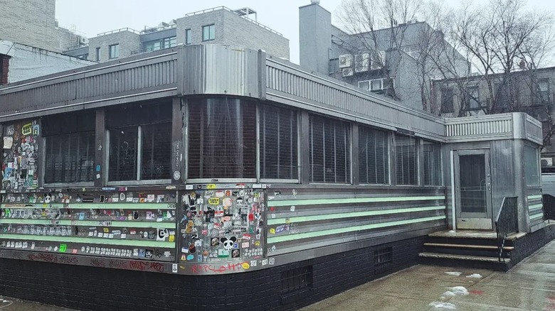 exterior of Wythe Diner in Brooklyn with bare trees in the background