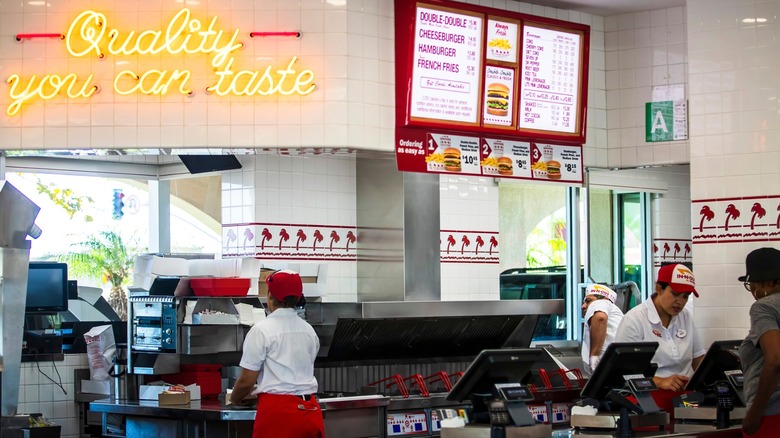 Employees working behind counter at In-N-Out Burger