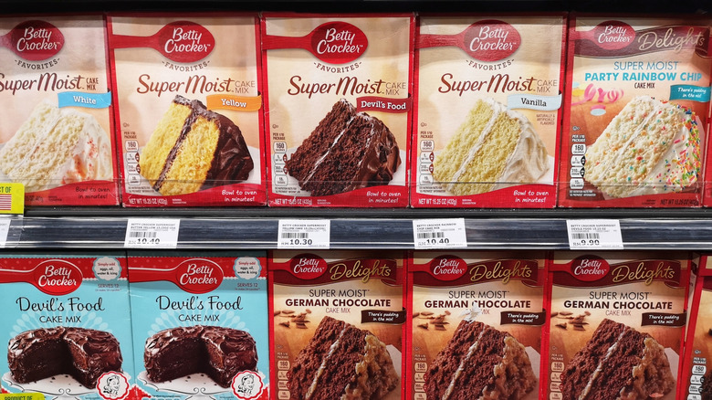 Boxes of Betty Crocker cake mix displayed for sale on a supermarket shelf