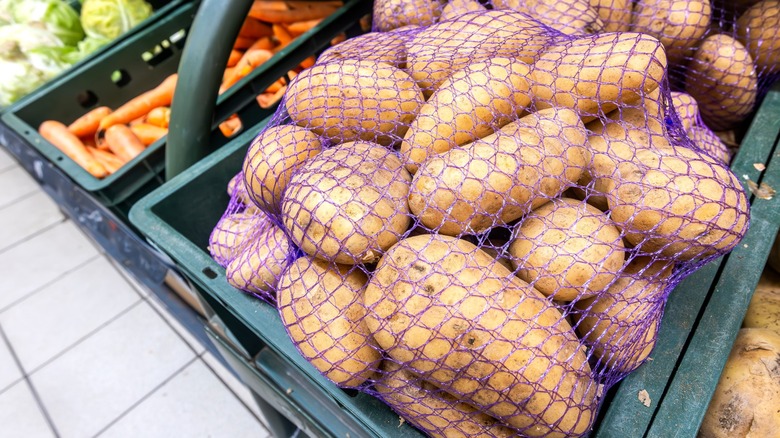 Potatoes packed in mesh bags at the grocery store