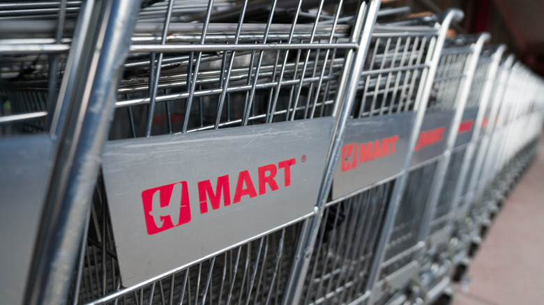 Row of grocery carts branded with the H Mart logo