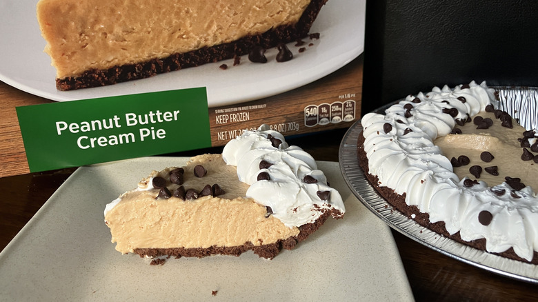 Slice of peanut butter and chocolate cream pie with Marie Callender's package in background.