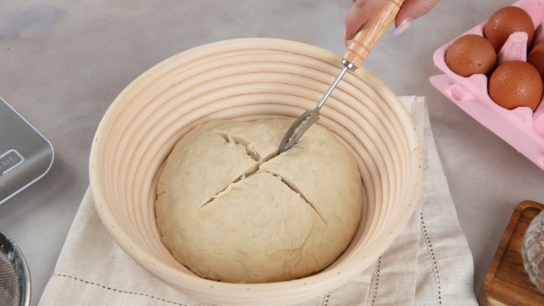 Bread dough being scored.