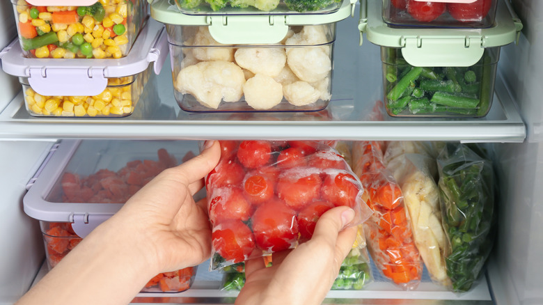Fruits and veggies on refrigerator shelves
