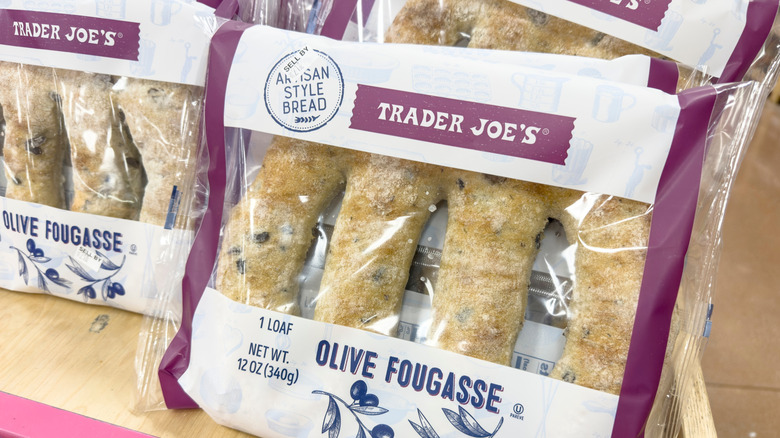 Packages of Trader Joe's olive fougasse stacked against each other on the store shelf.