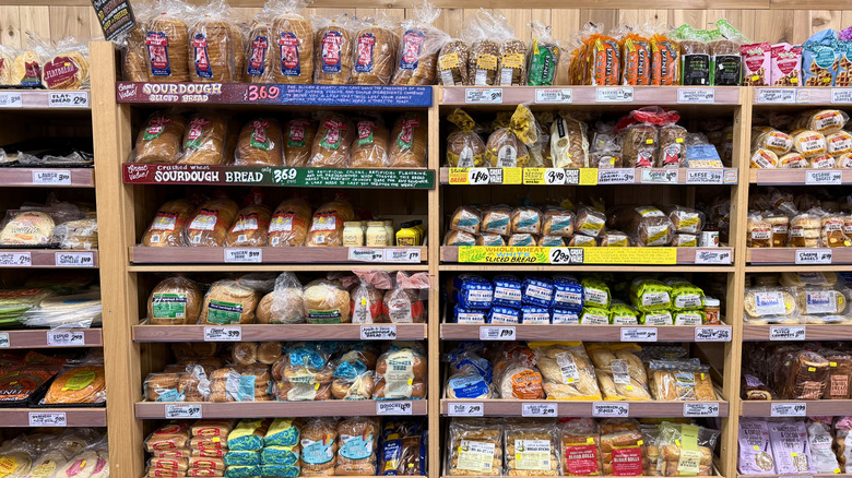 Trader Joe's bakery section with various breads on shelves.