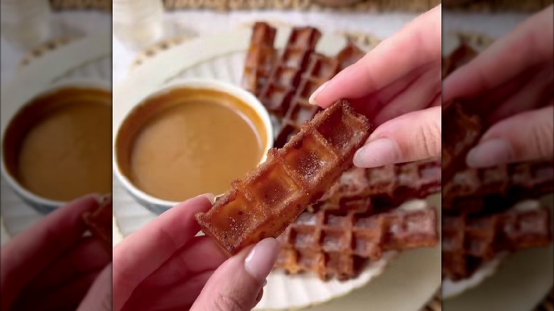 waffle churro held in hands