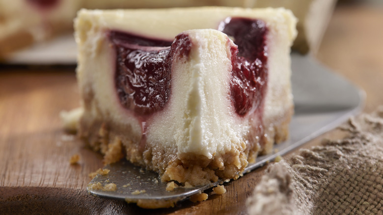 Close-up of small raspberry swirled cheesecake slice