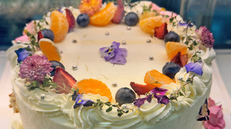Cake topping with fruits and flowers
