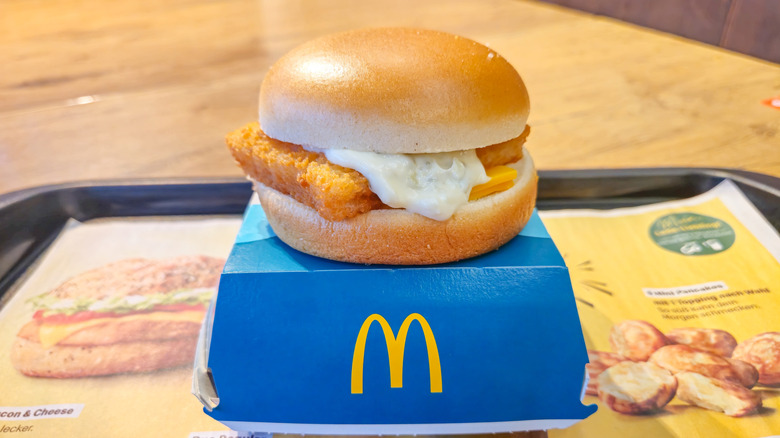 McDonald's Filet-O-Fish sandwich perched on a cardboard box