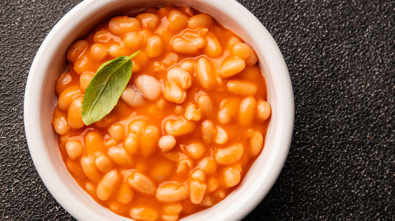 Bowl of baked beans with garnish
