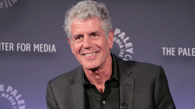 Anthony Bourdain posing for photograph