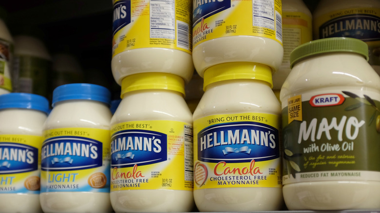 Jars of mayonnaise brands on a grocery store shelf