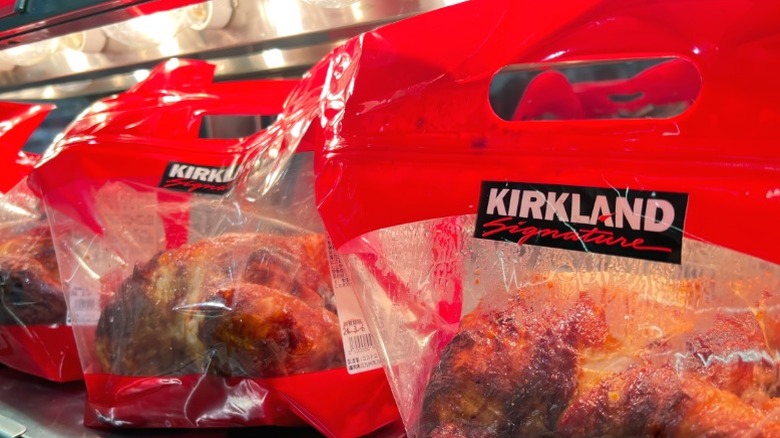 Several Kirkland rotisserie chickens on display at Costco.