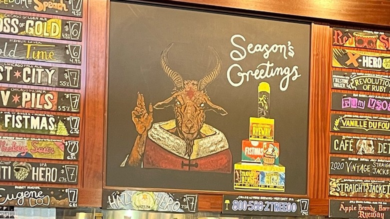 Beer menu flanking a chalkboard Christmas beer illustration