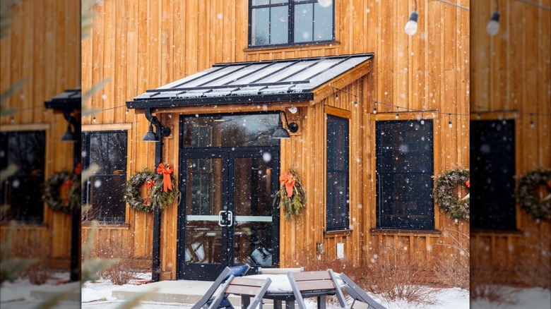 Exterior of Tilted Barn Brewery during light snow in winter