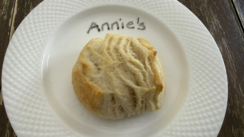 Annie's biscuit on white plate on table surface.