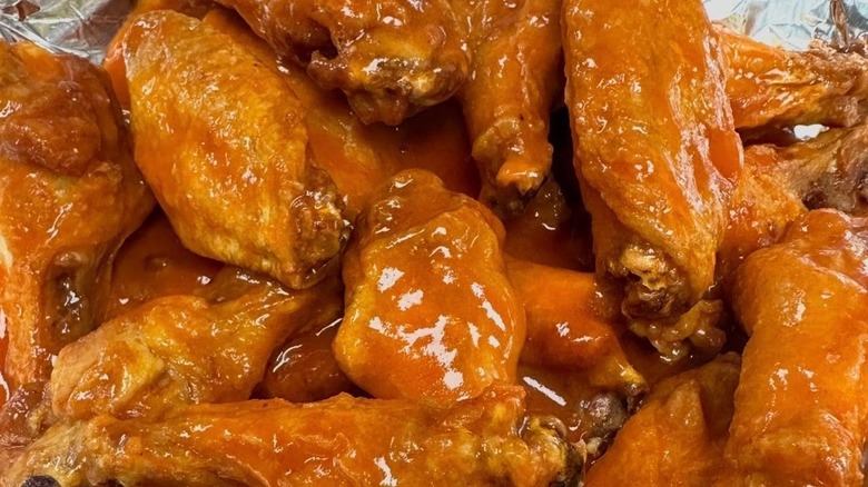 Pile of saucy wings on tinfoil