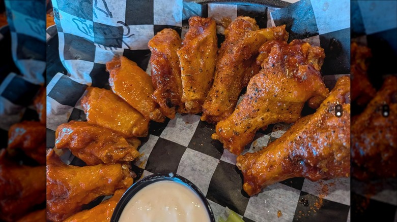 Basket of wings with a side of ranch dressing