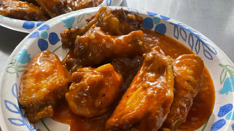 Paper plate with super saucy chicken wings