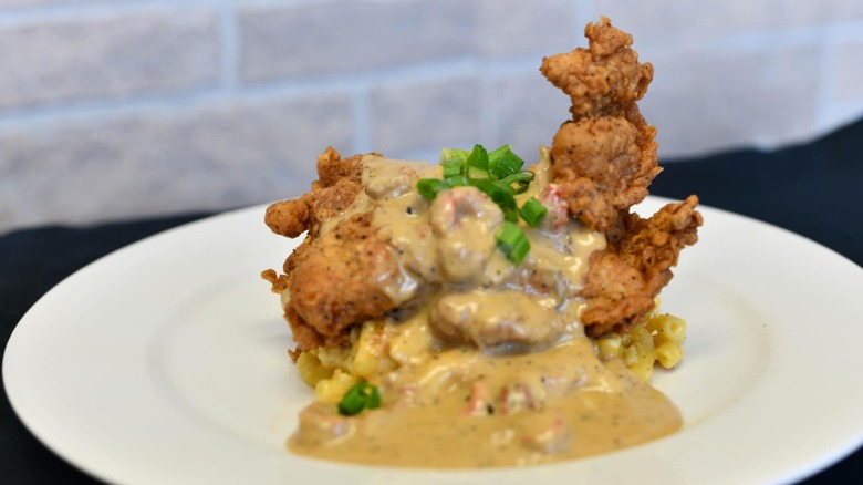 Fried chicken covered with gravy