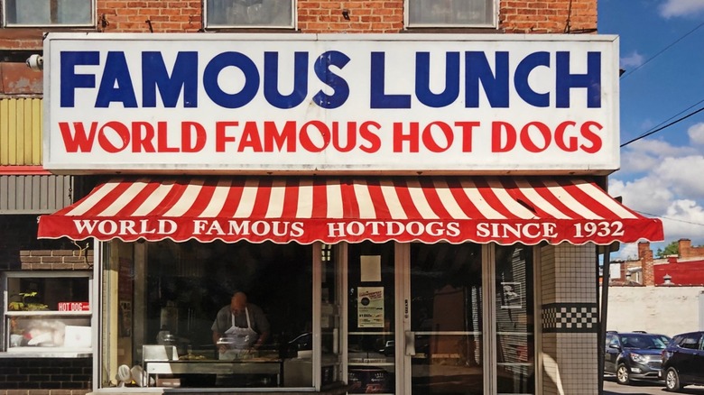 Famous Lunch Exterior with sign and red and white striped awning