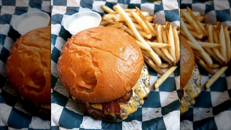 Hondo's burger closeup with fries and ranch dipping sauce