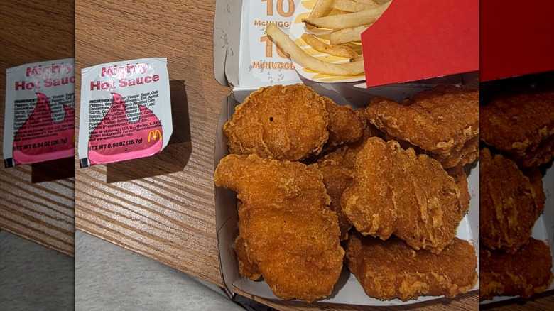A 10 piece Spicy Chicken McNugget meal with fries and Mighty Hot Sauce