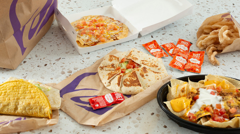 A selection of Taco Bell items laid out on a table in open packaging