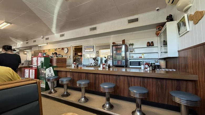 Interior counter seating shown at Tasty Crust